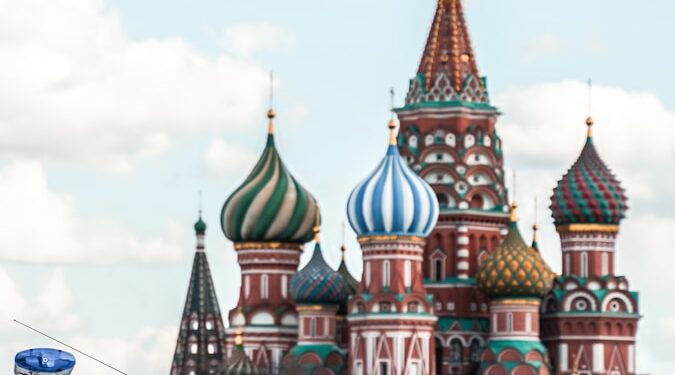 people walking on street near brown and green concrete building during daytime