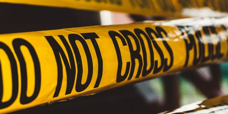 do not cross police barricade tape close-up photography