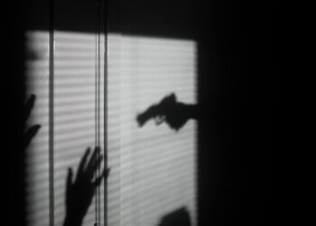 silhouette of person on window