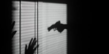 silhouette of person on window