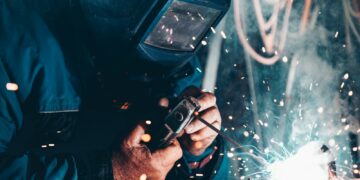 man using welding machine