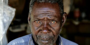 man wearing blue collared top