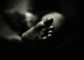 greyscale photo of person's feet