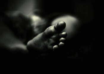 greyscale photo of person's feet
