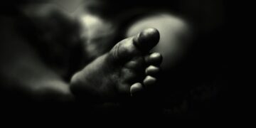 greyscale photo of person's feet
