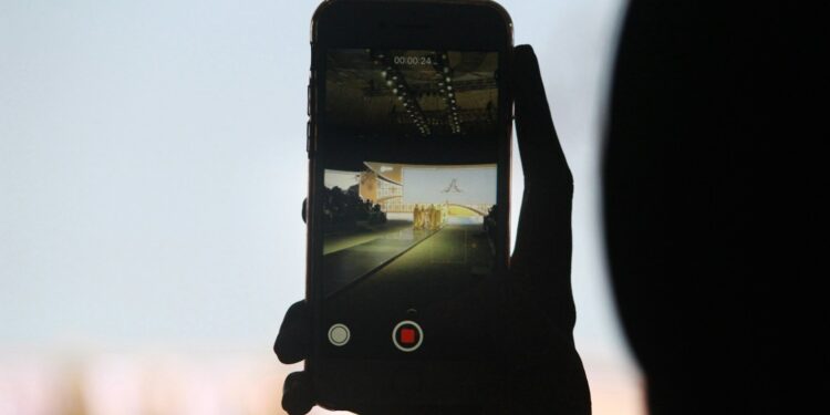 person using smartphone camera