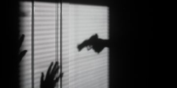 silhouette of person on window